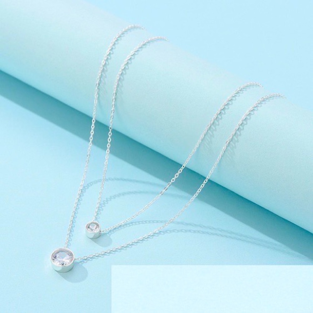 Layer silver plated and diamond pendent necklace.